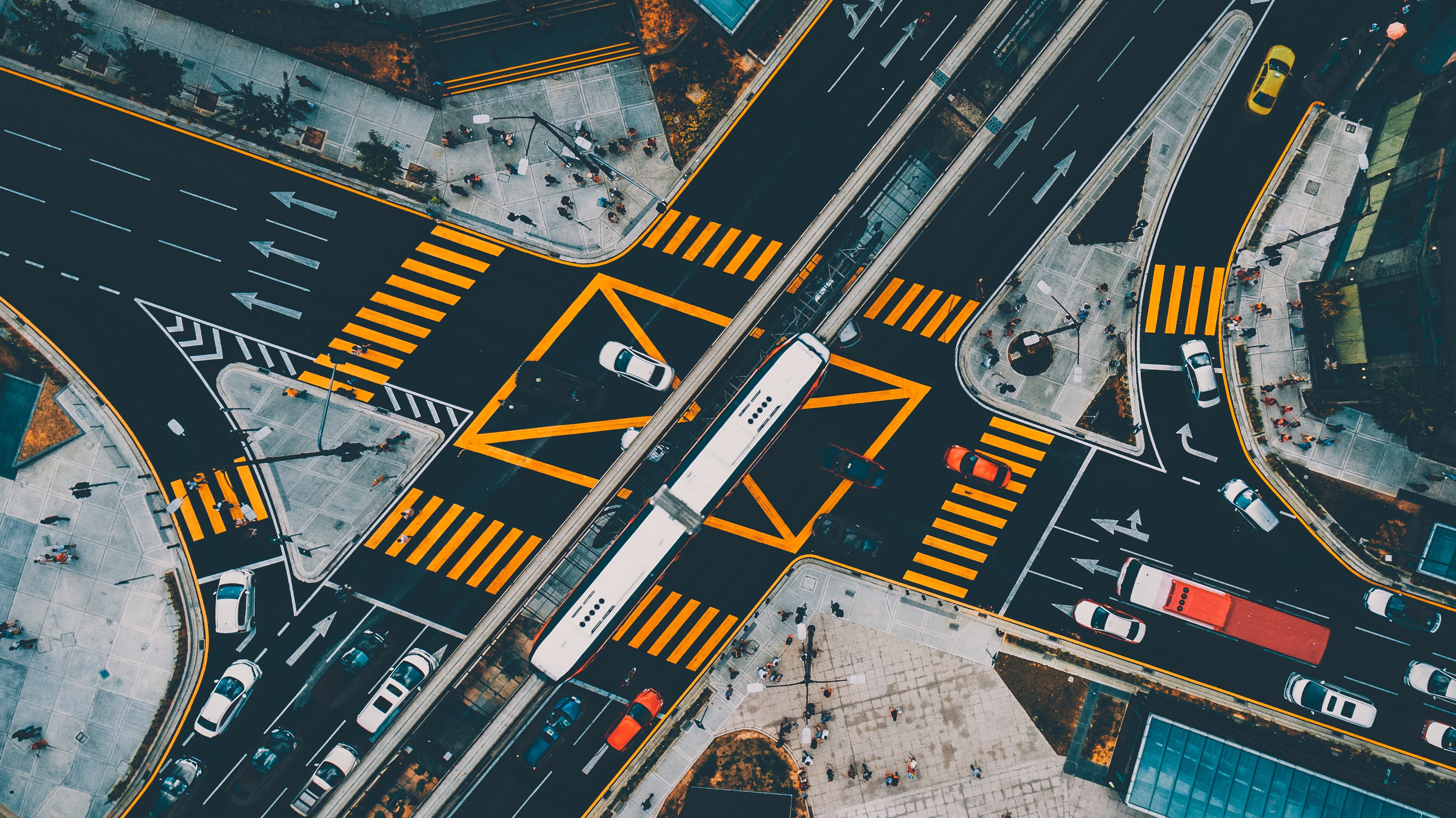 A large and well-traveled, perpendicular street intersection in Kuala Lumpur, Malaysia.