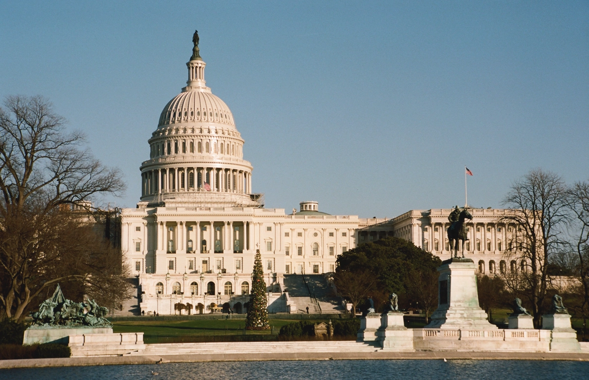 A view of the United States Capitol building around Christmas time. Taken from across the Capitol reflecting pool.